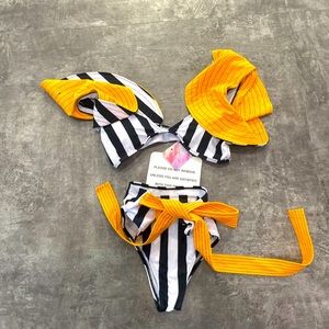 Yellow and navy swimsuit with yellow flare shoulders